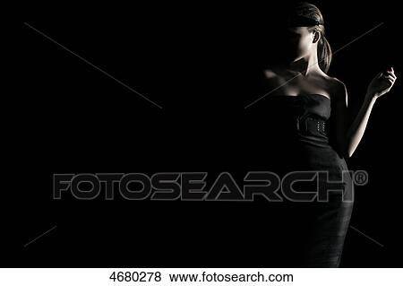 Young woman in black dress View Large Photo Image Stock Photo - Young woman in black dress . Fotosearch