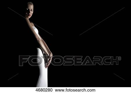 Young woman in white dress View Large Photo Image Stock Image - Young woman in white dress . Fotosearch