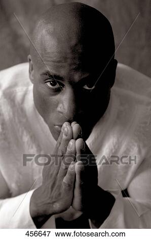 Stock Photo - African man looking at camera . Fotosearch