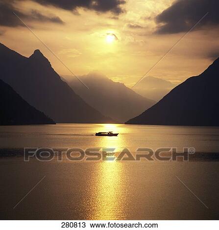 Stock Image - Boat in lake, Lake Lugano, Ticino Canton, Switzerland . Fotosearch