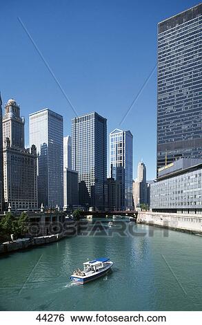 Stock Photograph - Boat in river in city, Chicago River, Wacker Drive, Chicago, Illinois, USA . Fotosearch
