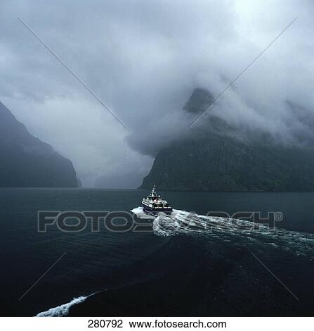Boat sailing in bay leaving trail of wake View Large Photo Image Stock Image - Boat sailing in bay leaving trail of wake . Fotosearch
