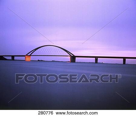 Bridge across river at dusk View Large Photo Image Stock Photograph - Bridge across river at dusk . Fotosearch