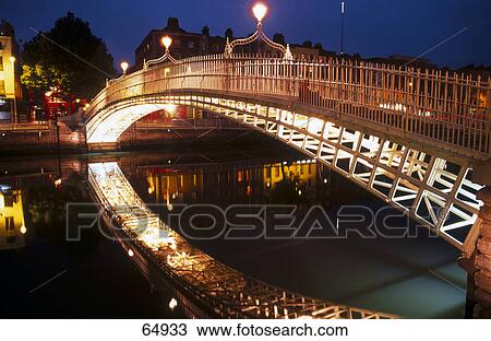Stock Image - Bridge over river, Ha'penny Bridge, Dublin, Republic Of Ireland . Fotosearch