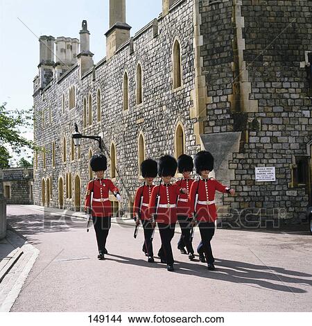 Picture - British royal guards marching in castle, Windsor Castle, Berkshire, England . Fotosearch
