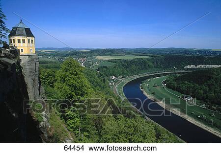 Picture - Building on a cliff overlooking a river, Saxony, Germany . Fotosearch