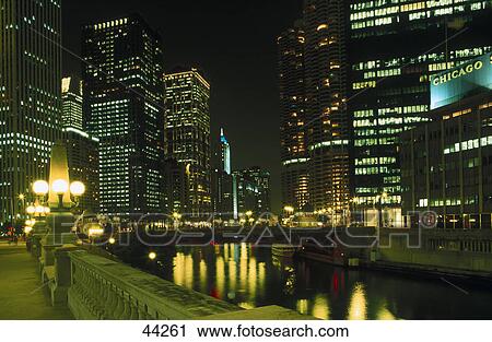 Buildings along river lit up at night, Marina Towers, Wacker Driver, Chicago River, Chicago, Illinois, USA View Large Photo Image Stock Image - Buildings along river lit up at night, Marina Towers, Wacker Driver, Chicago River, Chicago, Illinois, USA . Fotosearch