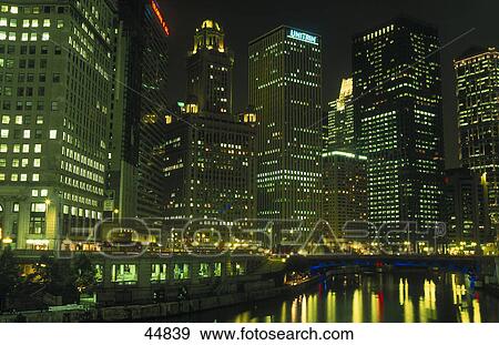 Buildings in city lit up at night, Wacker Drive, Chicago, Illinois, USA View Large Photo Image Stock Photo - Buildings in city lit up at night, Wacker Drive, Chicago, Illinois, USA . Fotosearch