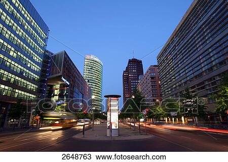 Buildings lit up at dusk, BahnTower, Kollhoff Tower, Potsdamer Platz, Berlin, Germany View Large Photo Image Stock Image - Buildings lit up at dusk, BahnTower, Kollhoff Tower, Potsdamer Platz, Berlin, Germany . Fotosearch
