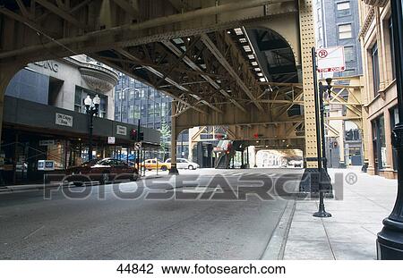 Car under elevated railroad tracks, South Dearborn Street, Chicago, Illinois, USA View Large Photo Image Stock Image - Car under elevated railroad tracks, South Dearborn Street, Chicago, Illinois, USA . Fotosearch