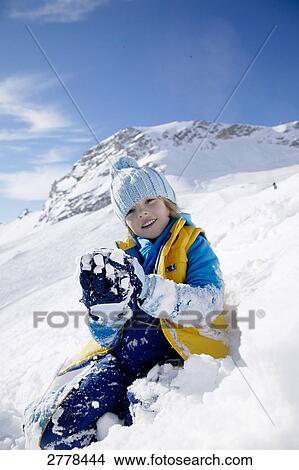 child playing in snow View Large Photo Image Picture - child playing in snow . Fotosearch