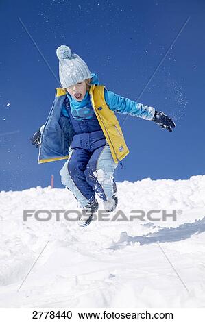 child playing in snow View Large Photo Image Stock Image - child playing in snow . Fotosearch
