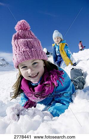 Stock Image - child playing in snow . Fotosearch