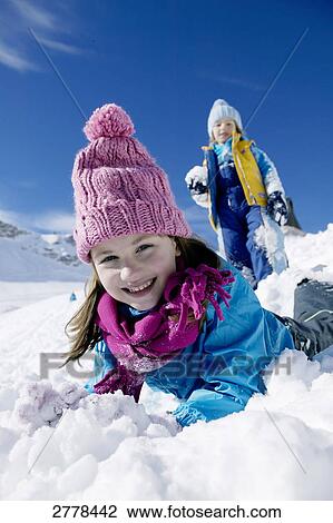 child playing in snow View Large Photo Image Stock Image - child playing in snow . Fotosearch