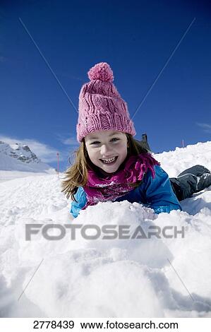 Stock Photo - child playing in snow . Fotosearch