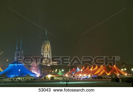 Stock Image - Circus in front of church, St Paul's Church, Theresienwiese, Munich, Bavaria, Germany . Fotosearch