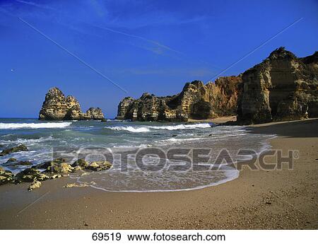 Cliffs on the beach, Praia Do Camilo, Lagos, Algarve, Portugal View Large Photo Image Stock Photo - Cliffs on the beach, Praia Do Camilo, Lagos, Algarve, Portugal . Fotosearch