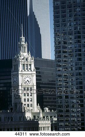 Stock Image - Clock tower in city, Wrigley Building, Chicago, Illinois, USA . Fotosearch