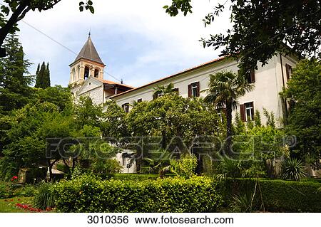 Stock Photograph - Cloister garden and church on Visovac Island, Croatia . Fotosearch