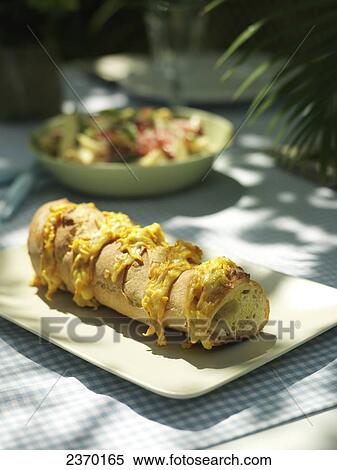 Stock Photography - Close-up of baguette on plate . Fotosearch