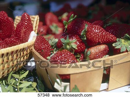 Stock Photo - Close-up of baskets of strawberries . Fotosearch