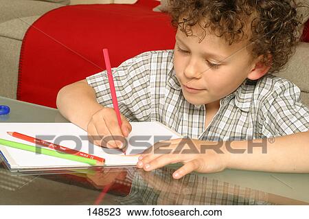 Close-up of boy drawing on paper View Large Photo Image Stock Image - Close-up of boy drawing on paper . Fotosearch
