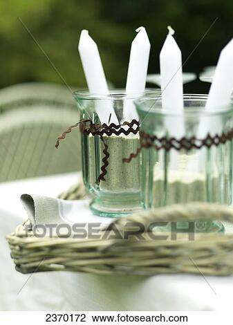 Stock Image - Close-up of candles in candlestick holders . Fotosearch