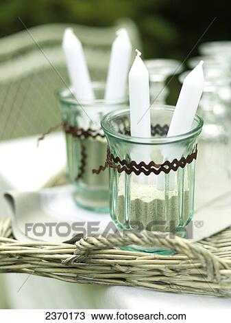 Stock Image - Close-up of candles in candlestick holders . Fotosearch