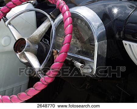 Stock Image - Close-up of car's steering wheel, Havana, Cuba . Fotosearch