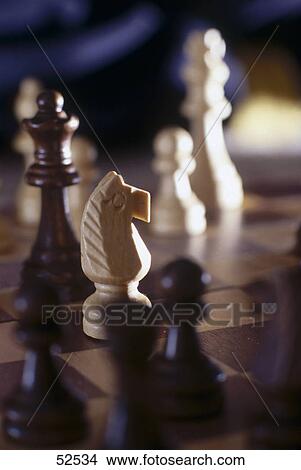 Close-up of chess pieces on chessboard View Large Photo Image Picture - Close-up of chess pieces on chessboard . Fotosearch