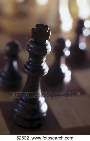 Close-up of chess pieces on chessboard View Large Photo Image Stock Image - Close-up of chess pieces on chessboard . Fotosearch