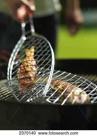 Close-up of fish on barbecue grill View Large Photo Image Stock Image - Close-up of fish on barbecue grill . Fotosearch