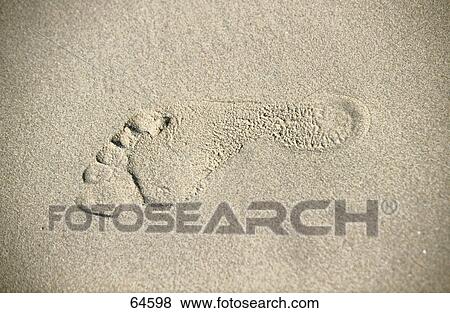 Stock Photo - Close-up of footprint on sand . Fotosearch