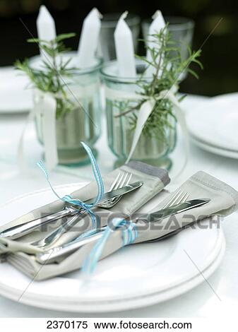 Stock Photography - Close-up of forks and knives tied together with ribbon . Fotosearch