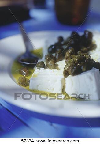 Close-up of goat cheese with olive oil View Large Photo Image Picture - Close-up of goat cheese with olive oil . Fotosearch