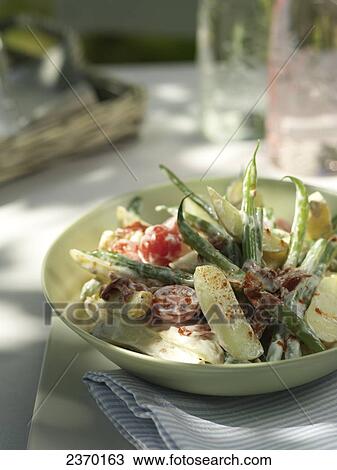 Close-up of green salad in bowl View Large Photo Image Stock Image - Close-up of green salad in bowl . Fotosearch