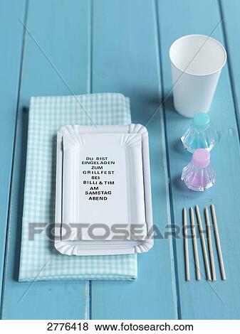 Stock Photo - Close-up of paper plate with disposable cup and pepper shaker on table . Fotosearch