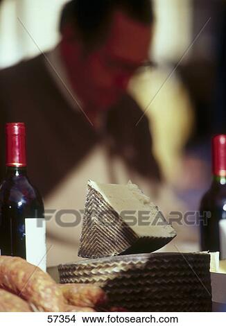 Close-up of sausages and cheese with wine bottle View Large Photo Image Picture - Close-up of sausages and cheese with wine bottle . Fotosearch
