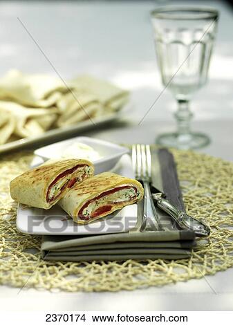 Picture - Close-up of slices of sprig roll on plate . Fotosearch