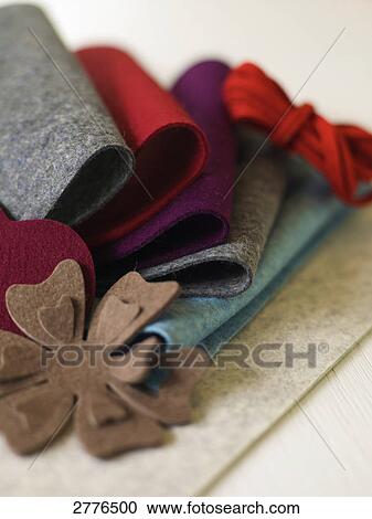 Stock Image - Close-up of table cloths and napkin holder on table . Fotosearch
