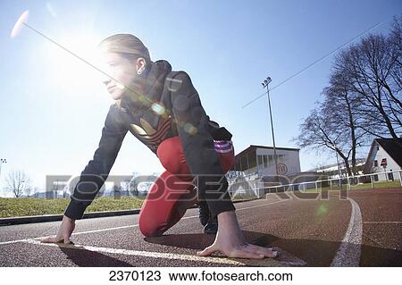 Close-up of teenage girl on starting blocks View Large Photo Image Stock Image - Close-up of teenage girl on starting blocks . Fotosearch