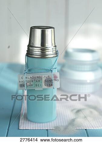 Close-up of thermos flask with tag on table View Large Photo Image Picture - Close-up of thermos flask with tag on table . Fotosearch