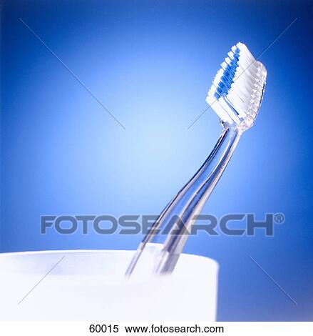 Stock Photography - Close-up of toothbrush in toothbrush holder . Fotosearch