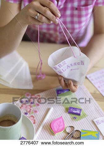 Close-up of woman making invitation card at table View Large Photo Image Stock Photo - Close-up of woman making invitation card at table . Fotosearch
