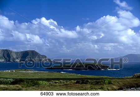 Stock Image - Clouds over bay, Trawmore Bay, Achill Island, County Mayo, Republic Of Ireland . Fotosearch