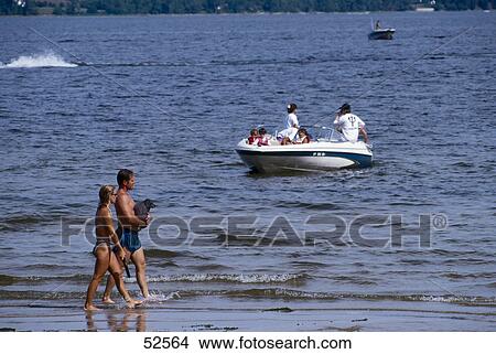 Couple walking on beach View Large Photo Image Picture - Couple walking on beach . Fotosearch