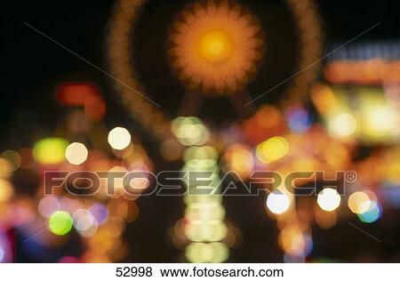 Defocused view of fairground lit up at night, Oktoberfest, Munich, Bavaria, Germany View Large Photo Image Stock Photo - Defocused view of fairground lit up at night, Oktoberfest, Munich, Bavaria, Germany . Fotosearch