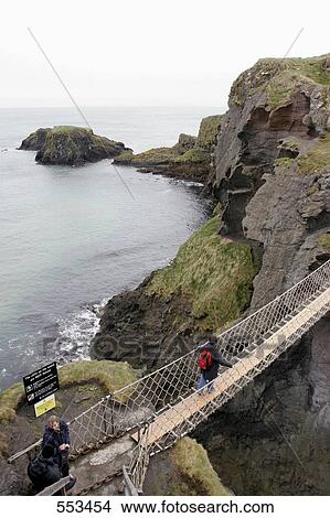 Picture - Elevated view on Carrick-a-Rede Rope Bridge to Carrick Island, Country Antrim, Ireland . Fotosearch