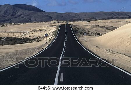 Empty road running through a rural landscape, Fuerteventura, Spain View Large Photo Image Stock Photograph - Empty road running through a rural landscape, Fuerteventura, Spain . Fotosearch