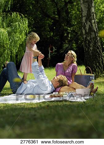 family doing picnic, full shot View Large Photo Image Stock Image - family doing picnic, full shot . Fotosearch